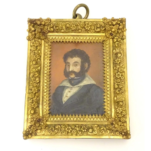 814 - A 19thC oil on board portrait miniature depicting a gentleman wearing a blue jacket, a wide collared... 