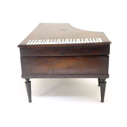 817 - A 19thC Palais Royal music box / etui / necessaire of grand piano form with inlaid detail, a fitted ... 