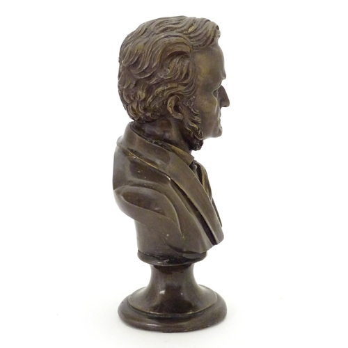 827 - A 19thC cast bronze bust of the German composer Wilhelm Richard Wagner. Approx. 9