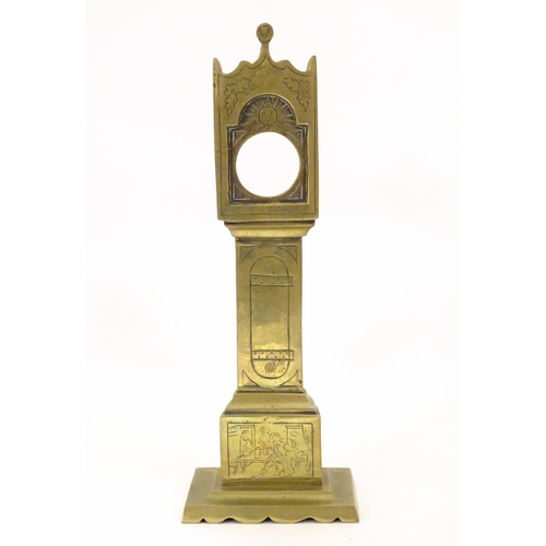 829 - A late 19th / early 20thC brass pocket watch holder modelled as a miniature long case clock with nai... 