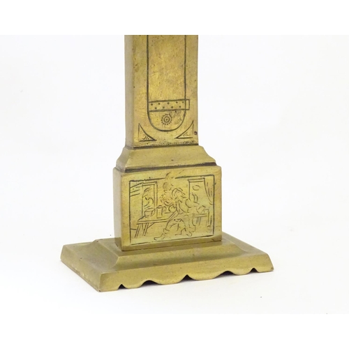 829 - A late 19th / early 20thC brass pocket watch holder modelled as a miniature long case clock with nai... 