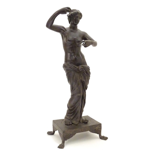 830 - A late 19th / early 20thC cast bronze sculpture modelled as a classical woman, possibly Venus / Aphr... 