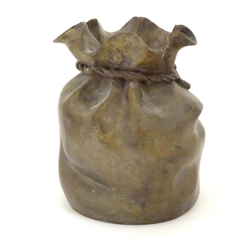 831 - A late 19thC cast bronze modelled as a sack with a rope tie. Marked under. Approx. 6 3/4