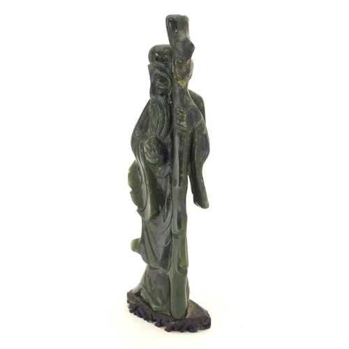 841 - A Chinese carved hardstone jade sage figure, possibly Shou-Hing, the Chinese god of longevity as a b... 