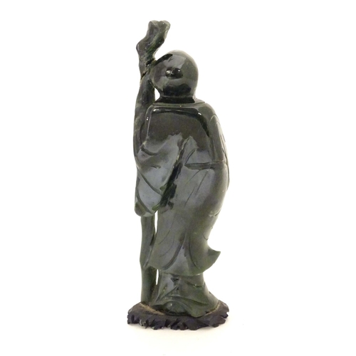 841 - A Chinese carved hardstone jade sage figure, possibly Shou-Hing, the Chinese god of longevity as a b... 