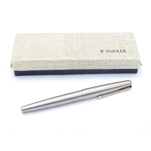 919 - A 20thC Parker convertible fountain pen with 14ct gold 585 nib. Contained within original box, with ... 