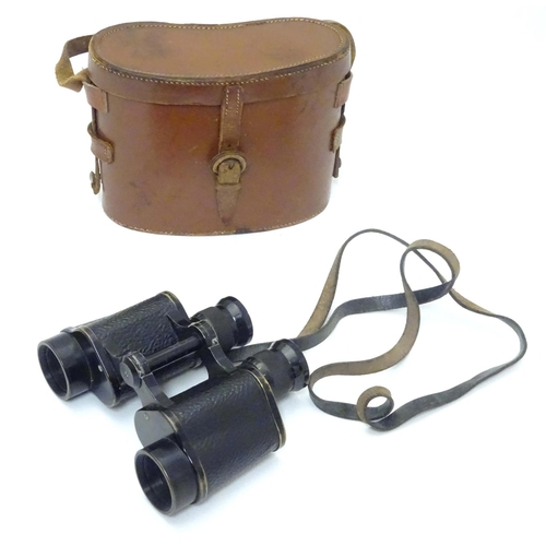 931 - A cased pair of binoculars / Field Glasses by A. Kershaw & Sons, Leeds, stamped 1941, approximately ... 