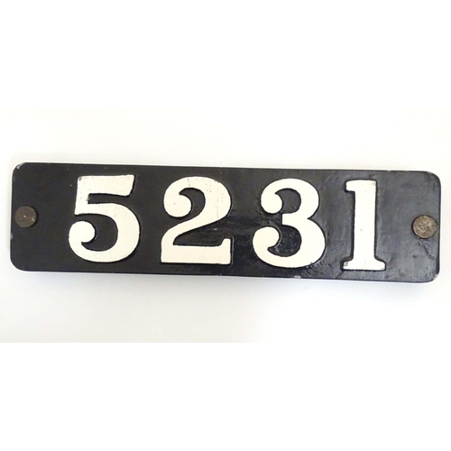 937 - A cast metal and painted number plaque 5231. Approx. 5 3/4