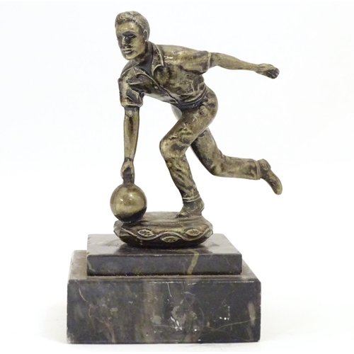 947 - A 20thC cast figure modelled as a man bowling, on a stepped marble base. Approx. 5 1/4