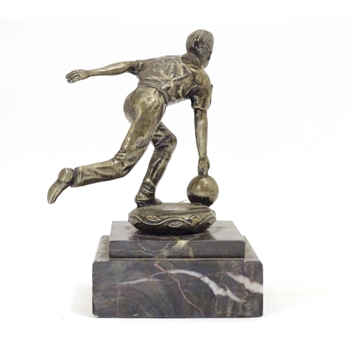 947 - A 20thC cast figure modelled as a man bowling, on a stepped marble base. Approx. 5 1/4