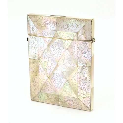 955 - A Victorian mother of pearl card case of rectangular form with a hinged lid and push button release.... 