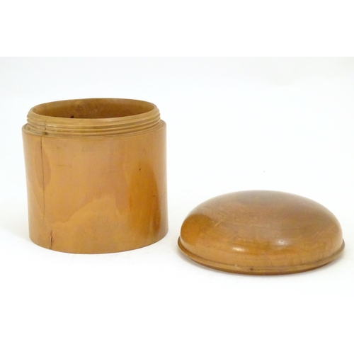 956 - A 19thC treen turned boxwood cylindrical pot with a domed lid. Approx. 3 1/4