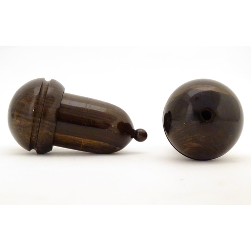 958 - Two 19thC lignum vitae treen containers formed as acorns unscrewing to reveal a lead weight within. ... 