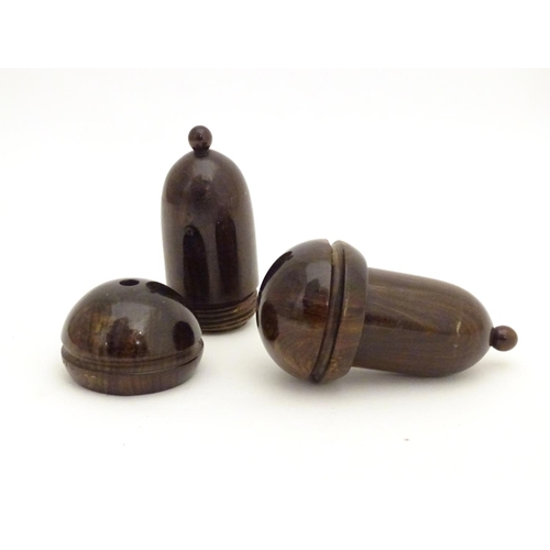 958 - Two 19thC lignum vitae treen containers formed as acorns unscrewing to reveal a lead weight within. ... 