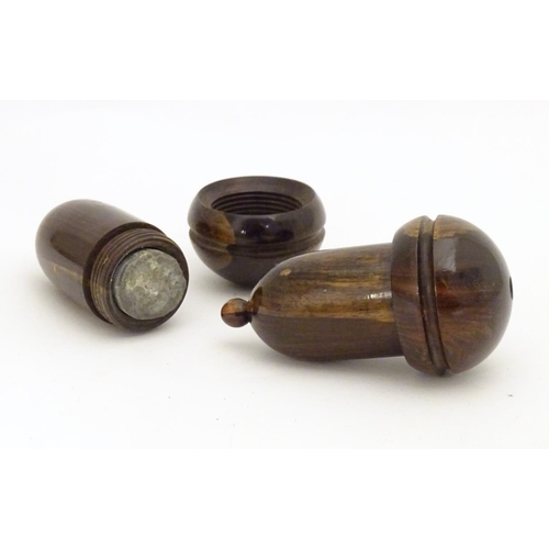 958 - Two 19thC lignum vitae treen containers formed as acorns unscrewing to reveal a lead weight within. ... 