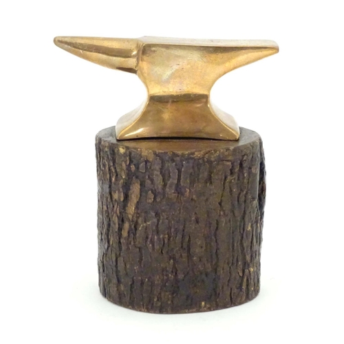 965 - An early 20thC small proportion brass model anvil mounted on a tree stump base with hammer. Approx. ... 