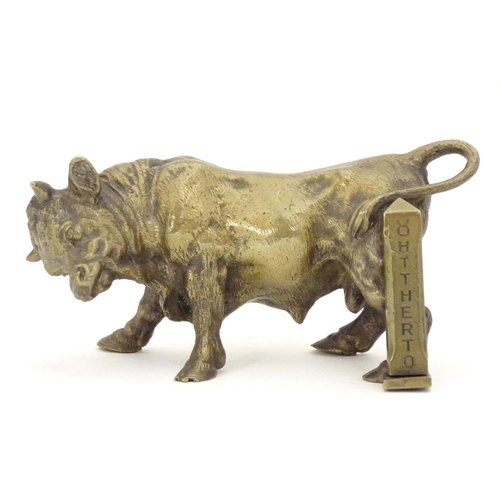 967 - An early 20thC brass model of a charging bull, with a post engraved From Harry Granger, Hitherto, 19... 