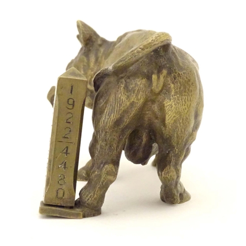 967 - An early 20thC brass model of a charging bull, with a post engraved From Harry Granger, Hitherto, 19... 