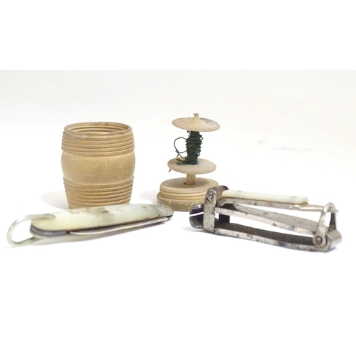 971 - Four assorted Victorian and later items to include a treen thread box of barrel form, a silver foldi... 