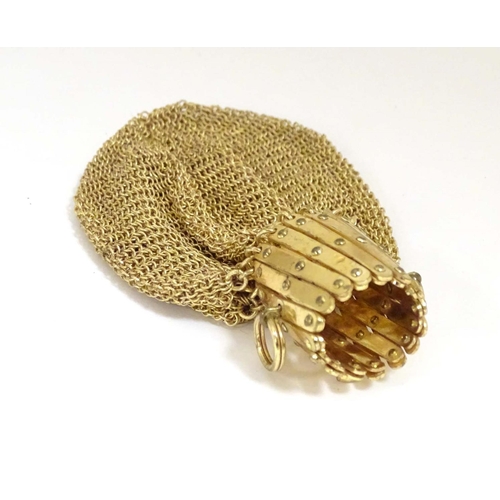 974 - A Victorian gilt metal miser purse with a concertina action. Approx. 4