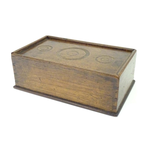 976 - A Georgian spice box, the sliding lid opening to reveal four sections within. The lid decorated with... 