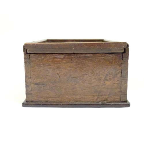 976 - A Georgian spice box, the sliding lid opening to reveal four sections within. The lid decorated with... 