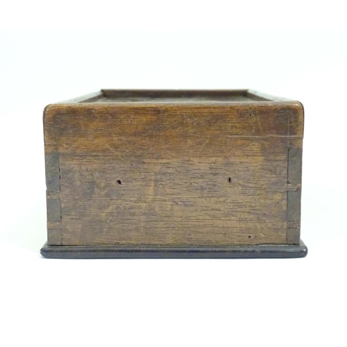 976 - A Georgian spice box, the sliding lid opening to reveal four sections within. The lid decorated with... 