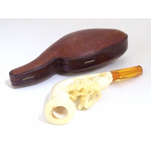 981 - An early 20thC cased ladies' carved meerschaum pipe, the bowl formed as a stag amongst foliage, with... 