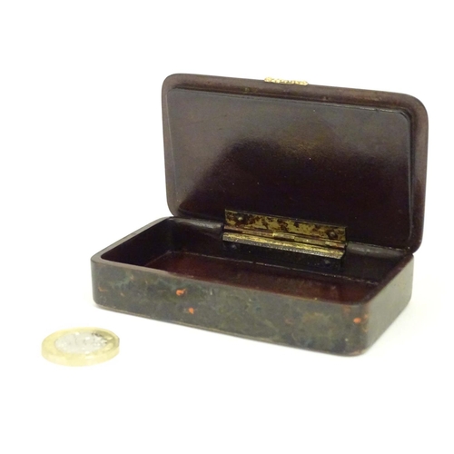 983 - A 19thC snuff box with lacquer finish resembling faux agate bloodstone with yellow metal mounts. App... 