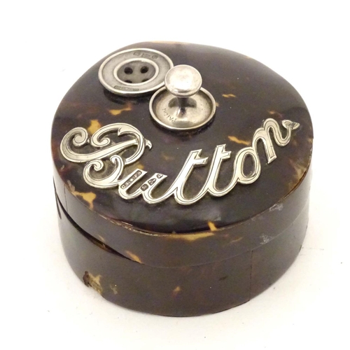 988 - A Victorian turned wooden button box with tortoiseshell veneer of circular form with silver mounts, ... 