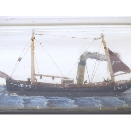 999 - A 20thC ship in a bottle / diorama depicting Kindred Star LT177, a steam trawler boat at sea. Approx... 