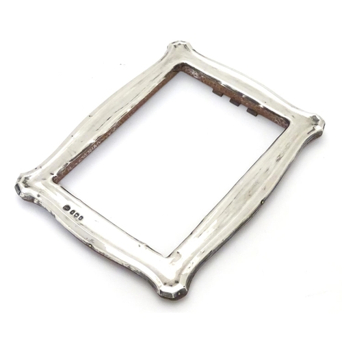 234 - A photograph frame with silver surround. Hallmarked Birmingham 1912 maker Jones & Crompton. 7