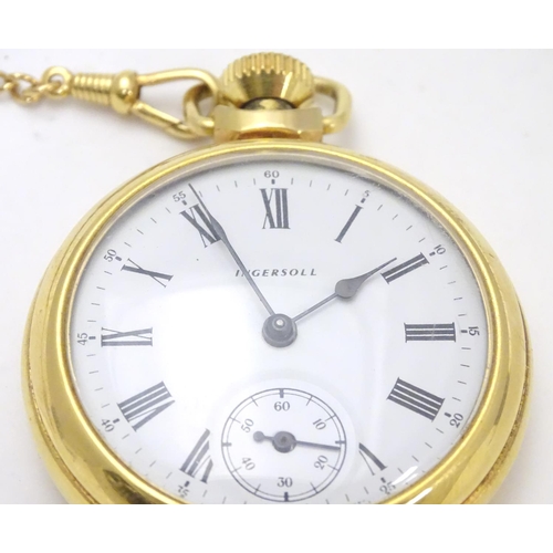 564 - An Ingersoll gold plated open faced pocket watch on gold plated watch chain. White enamel dial with ... 