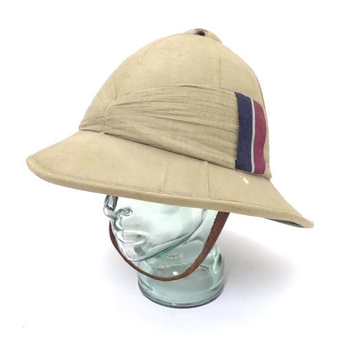 567 - Militaria , WWII / WW2 / Second World War: a Wolseley pattern tropical pith helmet, the khaki cotton... 