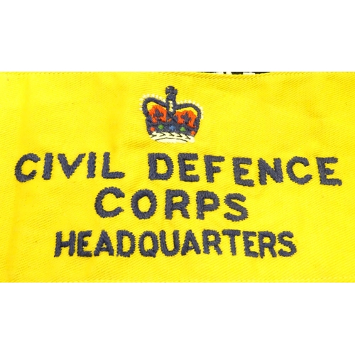 583 - Militaria: an assortment of 20thC military cloth badges, together with a 1954 Civil Defence Corps HQ... 