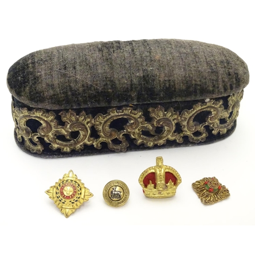 585 - Militaria: a white metal mounted oval sewing container/pin cushion, containing a British Army Lieute... 