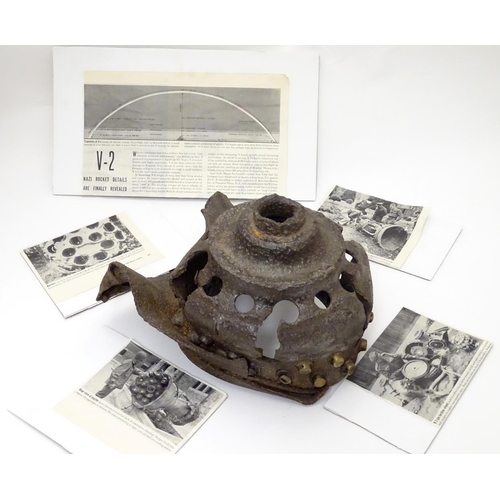 592 - Militaria : WW2 Crash site relic V2 Rocket combustion chamber

The partial combustion chamber of a V... 