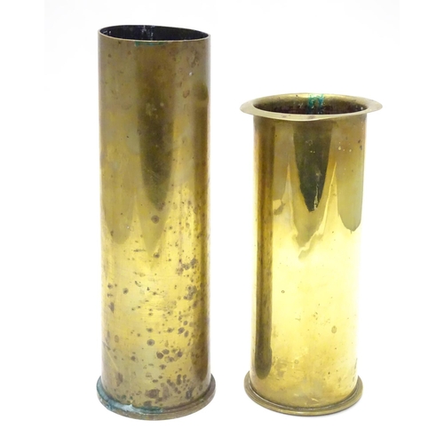 593 - Militaria : two brass artillery shell/cartridge cases, with headstamps for 1917 (German 77mm, WWI) a... 