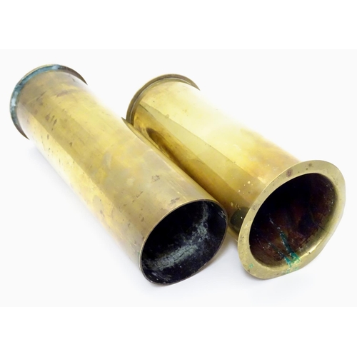 593 - Militaria : two brass artillery shell/cartridge cases, with headstamps for 1917 (German 77mm, WWI) a... 