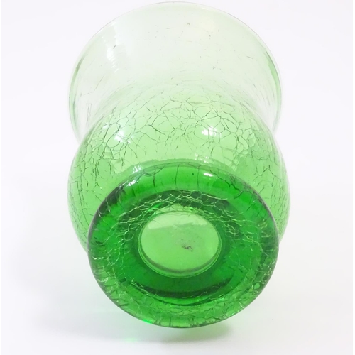 166 - A green glass vase with crackle detail. Approx. 6” high.