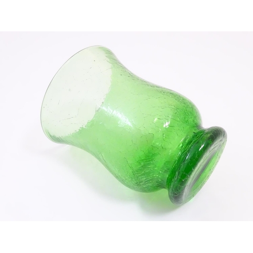 166 - A green glass vase with crackle detail. Approx. 6” high.