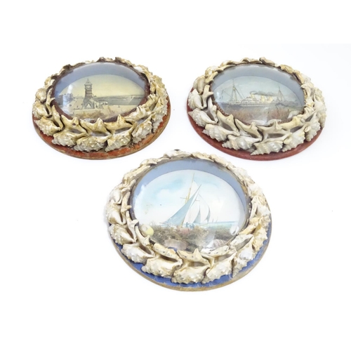 1000 - Three 20thC souvenir dioramas with shell art borders and printed coastal scenes, one depicting the t... 