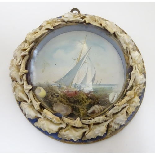 1000 - Three 20thC souvenir dioramas with shell art borders and printed coastal scenes, one depicting the t... 