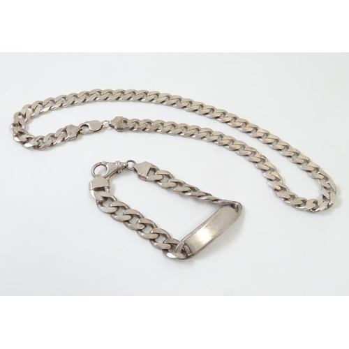 541 - A Gentleman's silver necklace and bracelet of chain form. The necklace 20