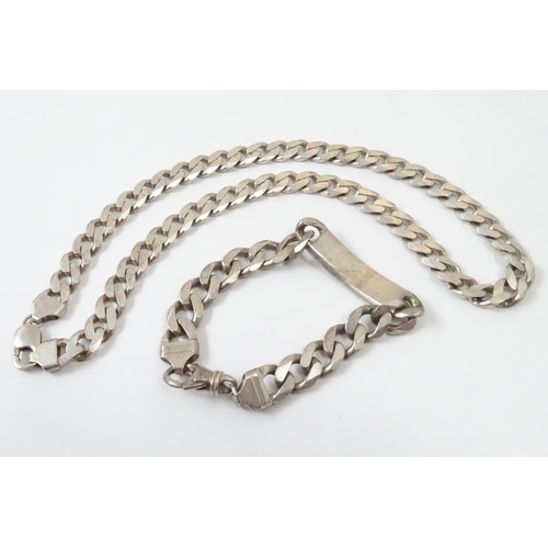 541 - A Gentleman's silver necklace and bracelet of chain form. The necklace 20