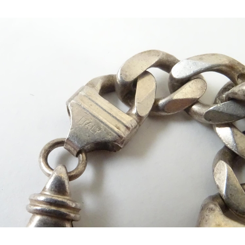 541 - A Gentleman's silver necklace and bracelet of chain form. The necklace 20