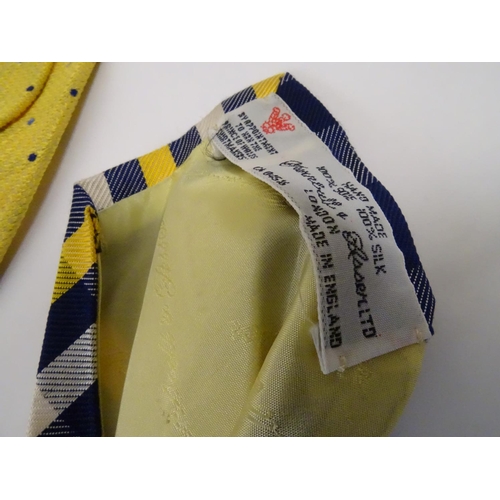 753 - 5 Turnbull & Asser London silk ties in yellow and navy designs. (5)