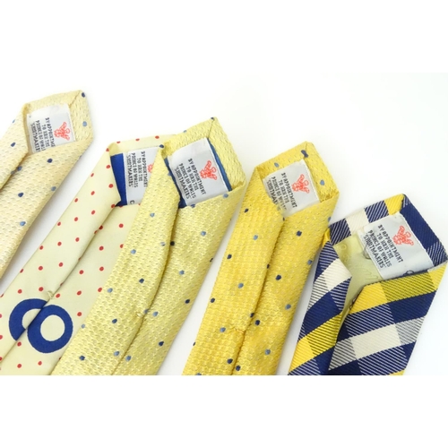 753 - 5 Turnbull & Asser London silk ties in yellow and navy designs. (5)