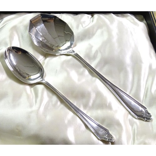 223A - A cased silver set of 12 spoons and 2 servers. Hallmarked Sheffield 1924 maker Cooper Brothers & Son... 