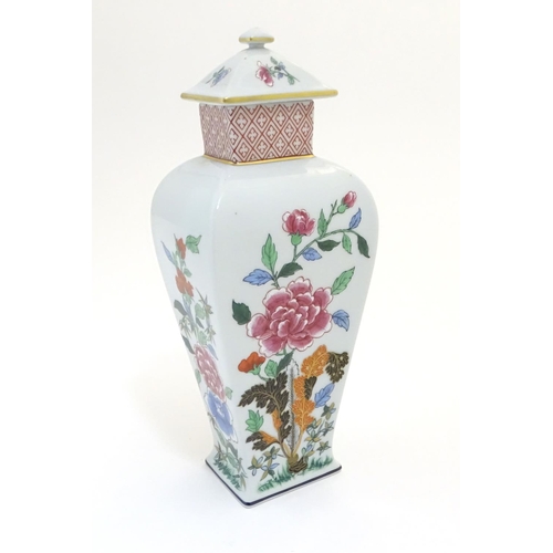 133 - A Portuguese Vista Alegre lidded vase with hand painted floral decoration. Approx. 10 1/4